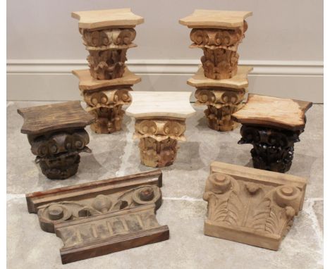 Five carved architectural wall capitals, of composite form (combining Corinthian and Ionic motifs), modelled on three sides w