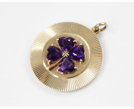A 14ct gold amethyst 'lucky' clover pendant, the central raised clover motif comprising four heart-shaped amethysts, claw set