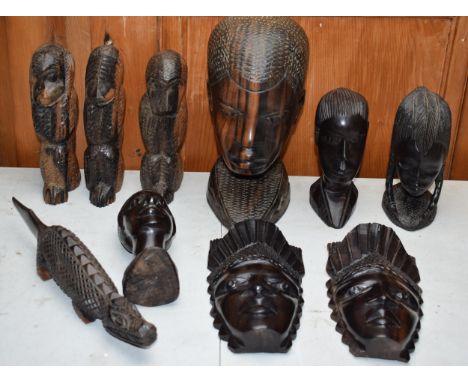 A collection of vintage 20th century African wooden carvings to include a large carved bust, 24cm tall, Hear No Evil, See No 