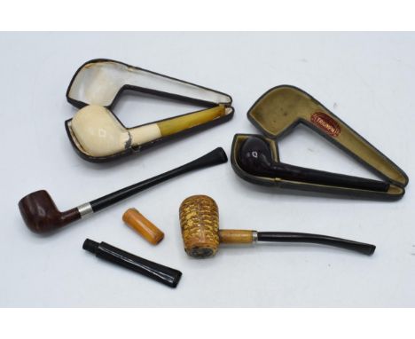 A collection of pipes to include a Toasted and Broken example, a briar pipe, and others with 2 cases (some damages).  