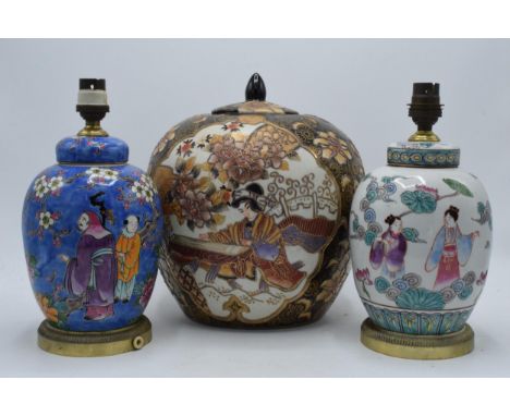 A large 20th century Japanese ginger jar with lid and tubelined decoration together with similar oriental enamelled lidded ja