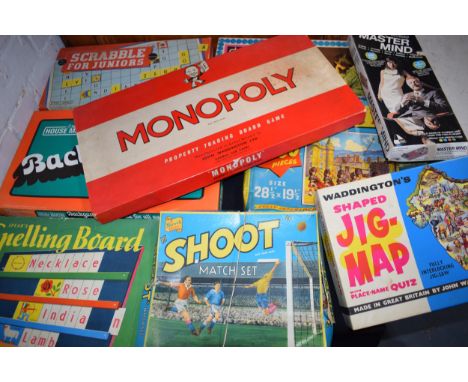Vintage board games to include Monopoly, Scrabble For Juniors, Mastermind and others, a vintage toy fort / castle and various