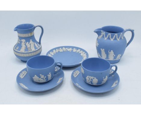 Wedgwood Jasperware in blue to include 2 cups, 2 saucers, 2 jugs and a side plate (7).  In good condition with no obvious dam