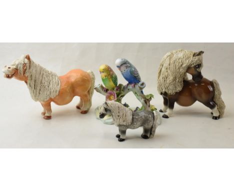 A trio of Cheval Ceramic horses to include a palomino, a brown and a grey horse together with Adderley Double Budgerigars (4)