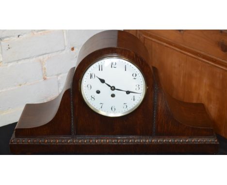 Large 1930s cased Napoleon mantle clock with key, 60cm wide.  