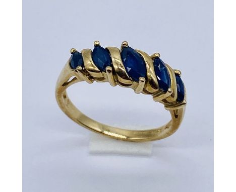 A sapphire 5 stone ring set in 9ct gold