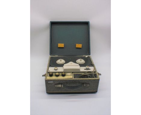 A vintage Alba portable reel to reel tape recorder.