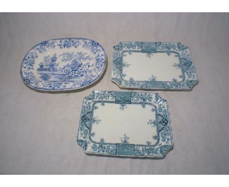 Three blue and white ceramic meat platters.