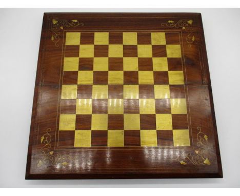 A modern wooden folding games board which includes a chess/checkers board and backgammon to inner 