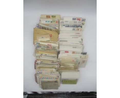 A large collection of first day covers and worldwide vintage correspondence envelopes.