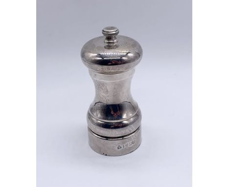 A hallmarked silver pepper grinder