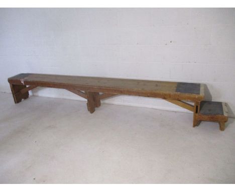 An industrial wooden bench with step - from Axminster Carpets - Length 336cm, height 46cm, depth 30cm