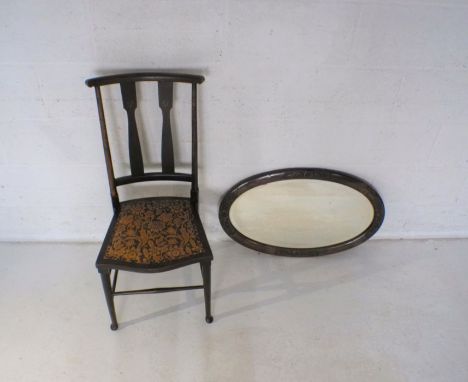 An Art Nouveau inlaid chair marked CK to base along with a carved mahogany oval wall mirror