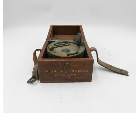 A wooden cased military issue medium landing compass.