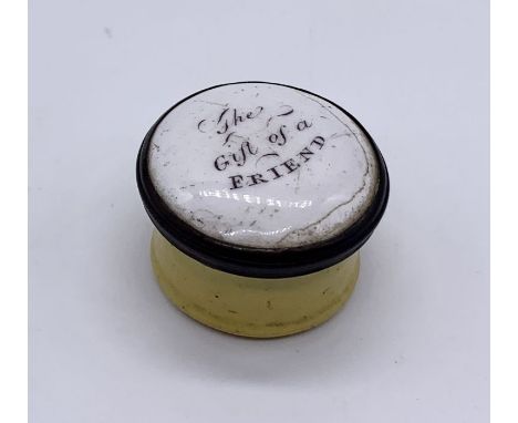 An 18th century enamelled circular pill or patch box, titled to the cover 'A gift of a friend'