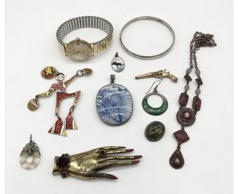 A small collection of jewellery, watch key in the form of a revolver, Mercury automatic watch etc.