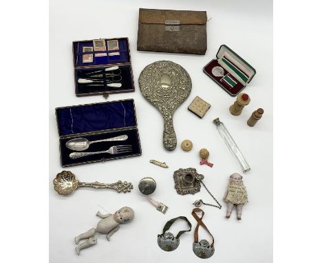 A collection of various items including Mappin &amp; Webb snake skin sewing kit, bisque Kewpie doll, Women's Service's medal 