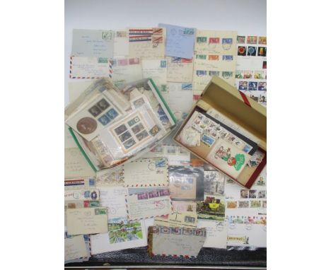 A collection of loose leaf worldwide stamps, envelopes, first day covers and postcards including a sheet of Penny Reds.