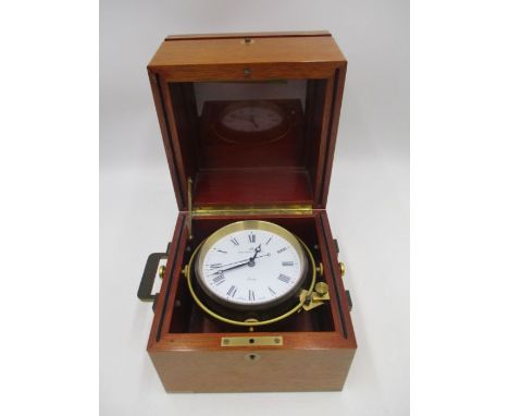 A modern Matthew Norman Swiss Made marine chronometer, housed in a mahogany case