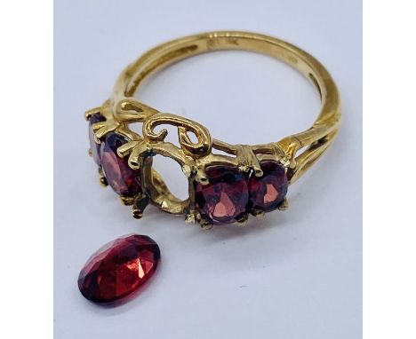 A 9ct gold garnet five stone ring- 1 stone loose but present