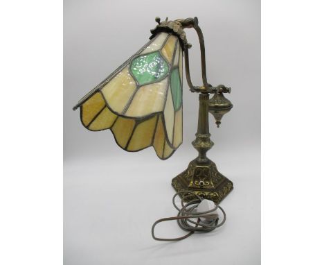 An antique style adjustable desk lamp with Tiffany style shade