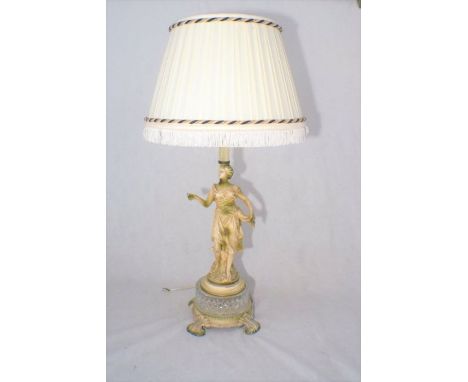 A metal and glass lamp base, in the form of a lady, including shade.