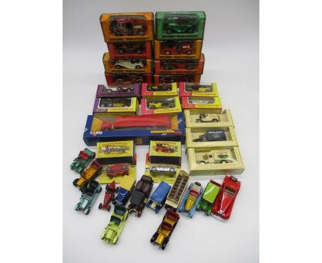 A collection of die-cast vehicles (boxed and loose) including Matchbox Models of Yesteryear, Lledo Promotors, Corgi Royal Mai