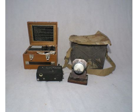 A Kolectric Covermeter Mark VI, along with a military daylight signalling lamp, a US Army Air Corps Body Assem GSAP Camera an