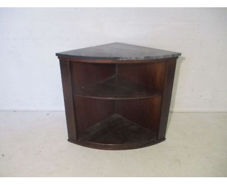 An oak bow fronted corner shelf, with marble top.