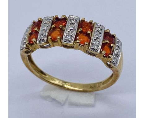 A gem and diamond set dress ring set in 9ct gold