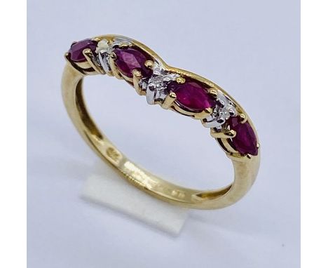 A ruby and diamond 7 stone ring set in 9ct gold