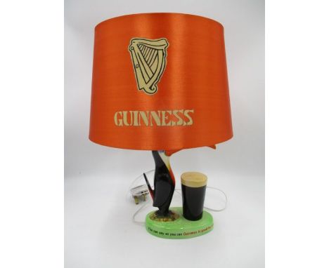 An original Carlton Ware Guinness Toucan advertising lamp with "If he can say as you can, Guinness is good for you" and ""How