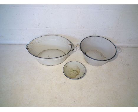 Three vintage enamel pots.