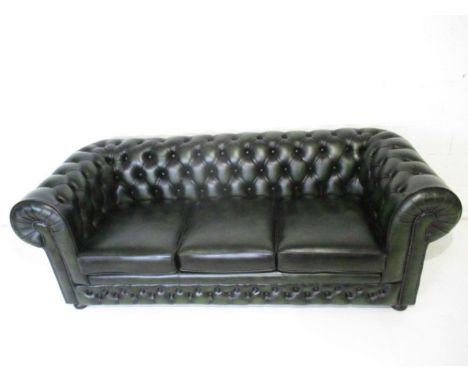 A Thomas Lloyd dark green three seater Chesterfield sofa, length 210cm.