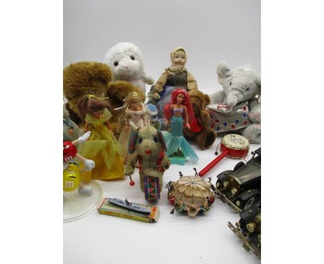 An assortment of vintage toys including Disney etc