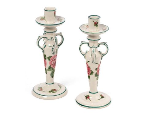 Wemyss: A pair of candlesticks, ornate handles, in Cabbage Rose patterns, 24cm tall (2).  In good condition with no obvious d