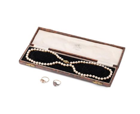 A string of cultured pearls, knotted, with 9ct gold clasp, set with seed pearl and green paste, pearls each between 6-7 grain