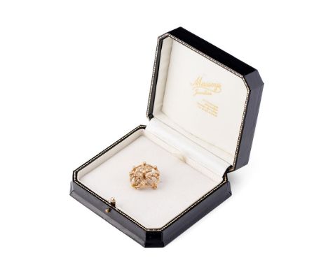 A 15ct gold and seed pearl brooch of quatrafoil form, 5.9g, 26.5mm diameter.
