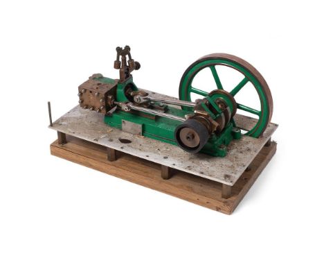 A  model of an stationary horizontal engine mounted on an aluminium base and wooden board. Height 17cm.  Engine turns as it s
