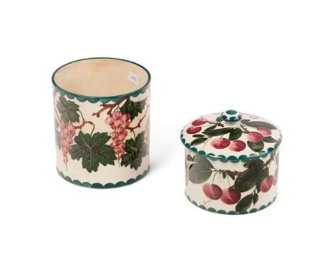 A Wemyss biscuits jar in the Cherries pattern, with lid, together with a Grapes preserve jar (2), tallest 12cm, retailed by T