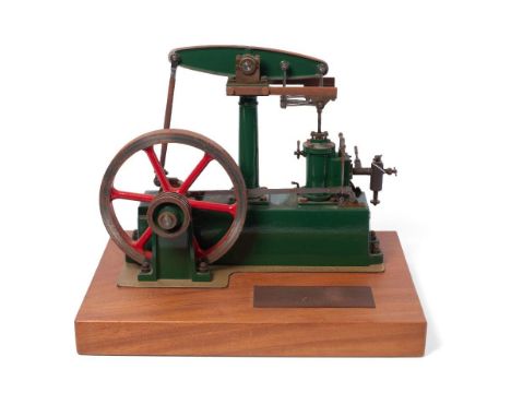 Stuart Turner stationary beam engine, red and green, fly wheel 7" diameter, mounted on wooden base 39.5 cm x 28 cm, engine he