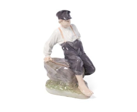 Royal Copenhagen figure of a boy with a fishing rod, no. 1659, 31cm tall.  In good condition with no obvious damage or restor