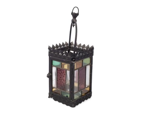 A late 19th / early 20th century porch lantern, pressed steel with cast frame and stained glass panels. Height 49cm.  With so