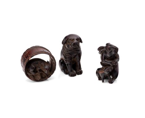 A group of three netsuke, one modelled as bulldog, or pug, another as a moon rabbit or hare with leveret, the last as a rat w