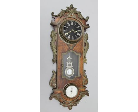 A 19TH CENTURY FRENCH OAK WALL CLOCK, profusely decorated with cast metal mounts, having plain black dial with glazed display