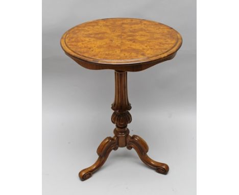 A VICTORIAN SATINWOOD VENEERED WINE TABLE, having circular top, on fluted stem with tripod supports terminating with scroll f