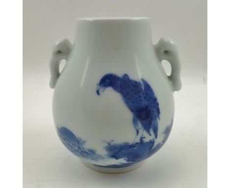 A CHINESE BLUE AND WHITE PORCELAIN VASE, moulded Ruyi handles to shoulders, hand painted cobalt blue to one side of an eagle 