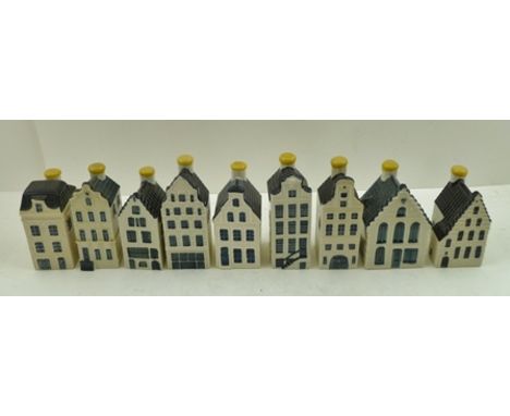 A COLLECTION OF NINE VARIOUS CERAMIC MODELS OF DELFT HOUSES, made by KLM to contain Bols alcoholic drink, tallest 11cm high 