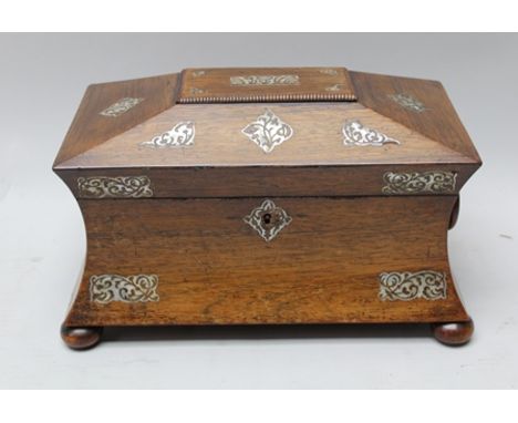 A 19TH CENTURY ROSEWOOD SARCOPHAGUS SHAPED TEA CADDY with mother of pearl inlaid decoration to hinged lid and sides, on ball 