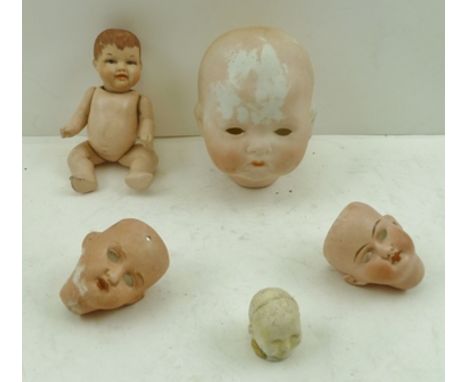 AN ARMAND MARSEILLE EARLY 20TH CENTURY BISQUE DOLL'S HEAD, incised to nape of neck "A.M. Germany, 341 3k", together with a SM